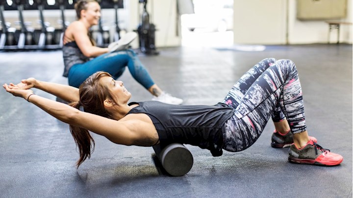 women-exercising-on-foam-rollers-in-gym-picture-id686409516.jpg